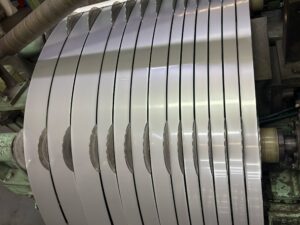 stainless steel precision strip slitting process showing narrow strips after processing